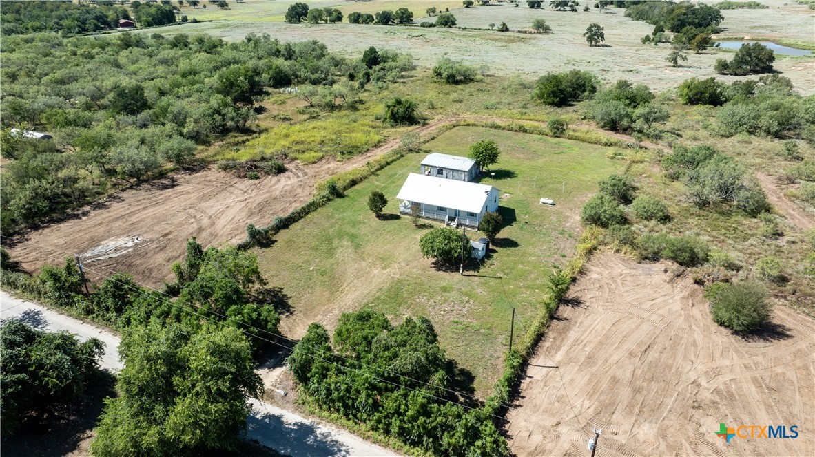 199 Sunset Trail Luling, TX 78648 - Photo 32 of 34 an aerial view of a house with a yard