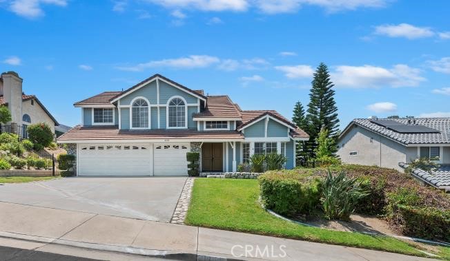 16541 Creekside Road Riverside, CA 92503 - Photo 1 of 1 a front view of a house with a garden