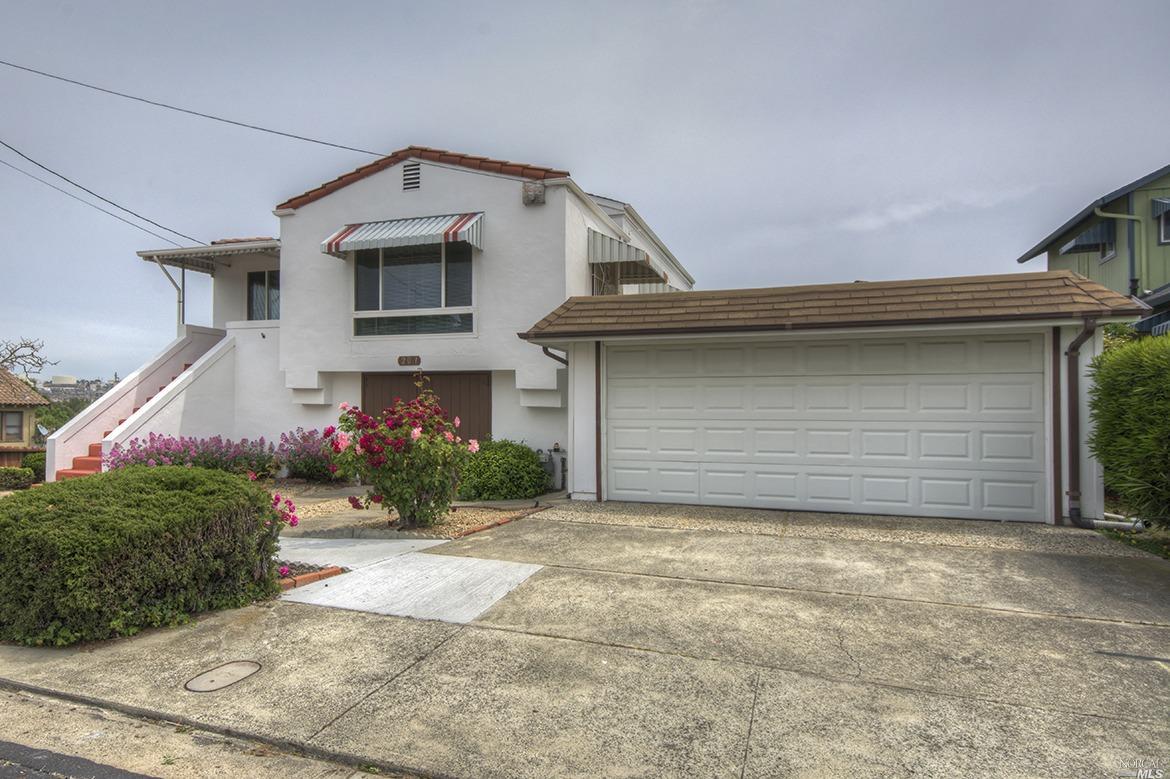 201 Napa Avenue Rodeo, CA 94572 - Photo 1 of 1 a front view of a house with a yard and garage