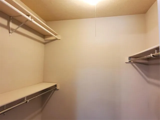 a view of a room with racks on the wall