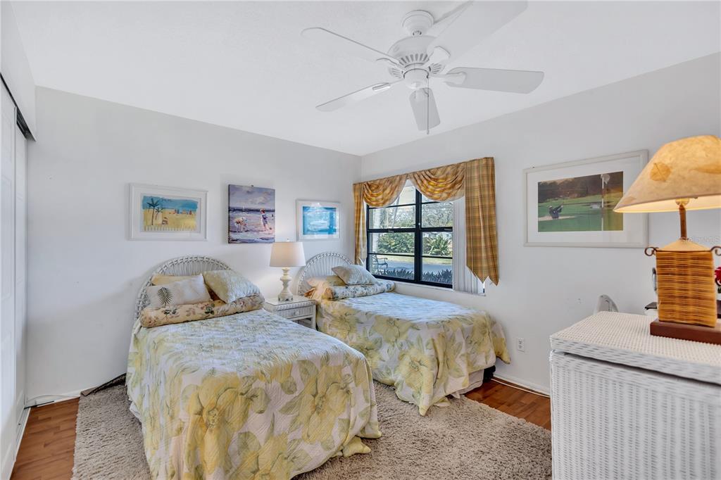 12300 Vonn Road, Unit 1102 Largo, FL 33774 - Photo 16 of 45 a bedroom with two beds and a window