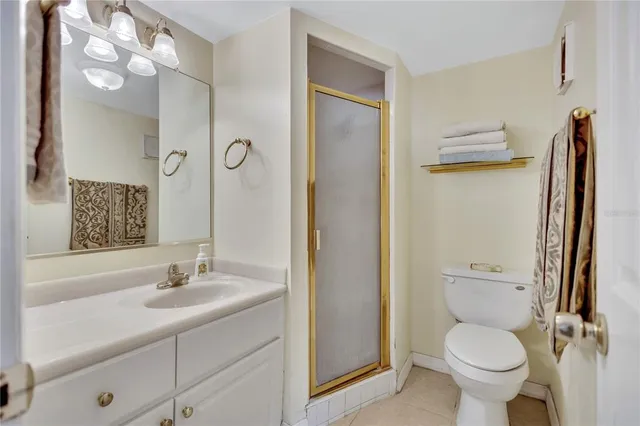 a bathroom with a toilet sink and a mirror