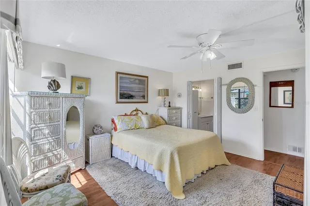 a bedroom with a bed couch and a window