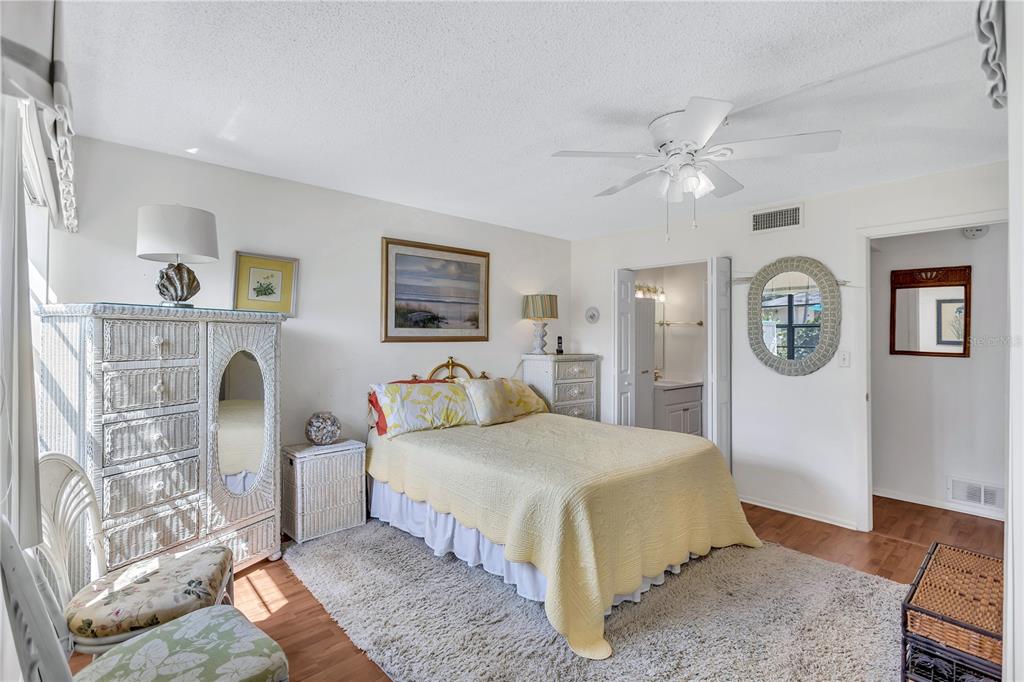 12300 Vonn Road, Unit 1102 Largo, FL 33774 - Photo 19 of 45 a bedroom with a bed couch and a window