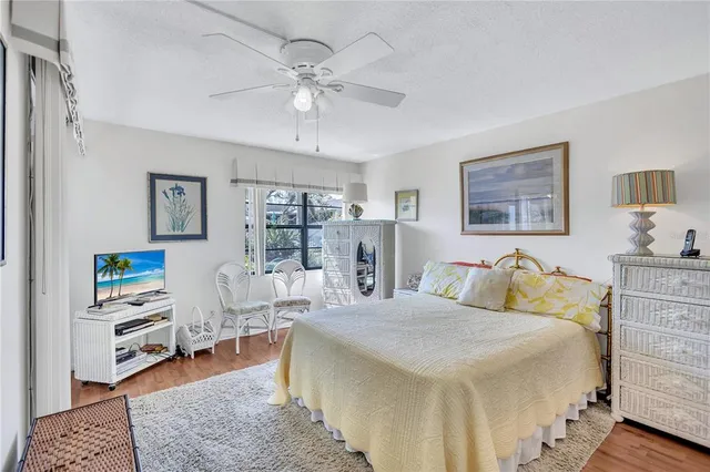 a bed room with a bed and a chandelier