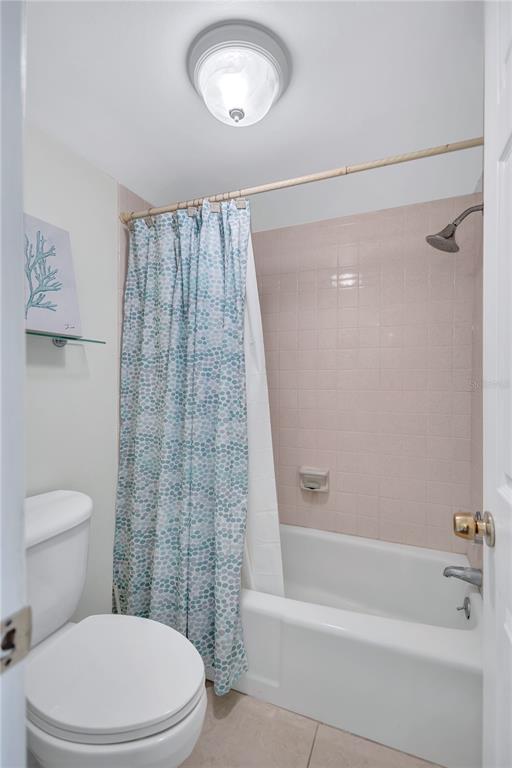 12300 Vonn Road, Unit 1102 Largo, FL 33774 - Photo 22 of 45 a white toilet sitting next to a bath tub