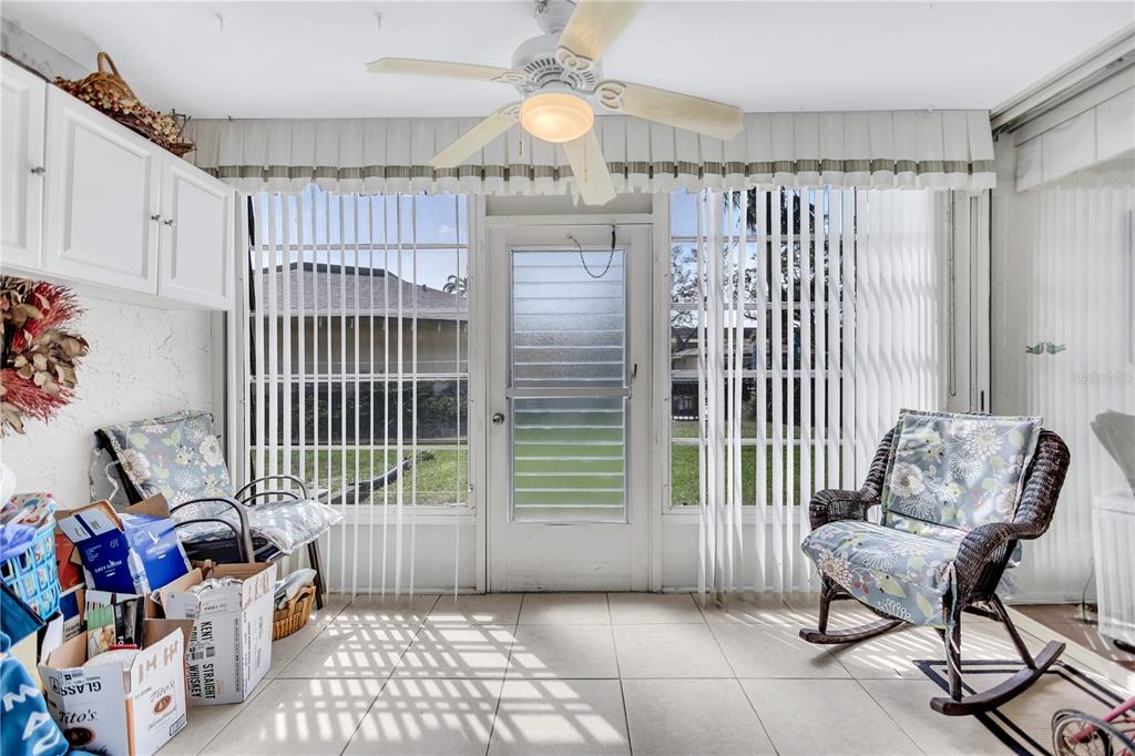 12300 Vonn Road, Unit 1102 Largo, FL 33774 - Photo 24 of 45 a bedroom with furniture and a chandelier