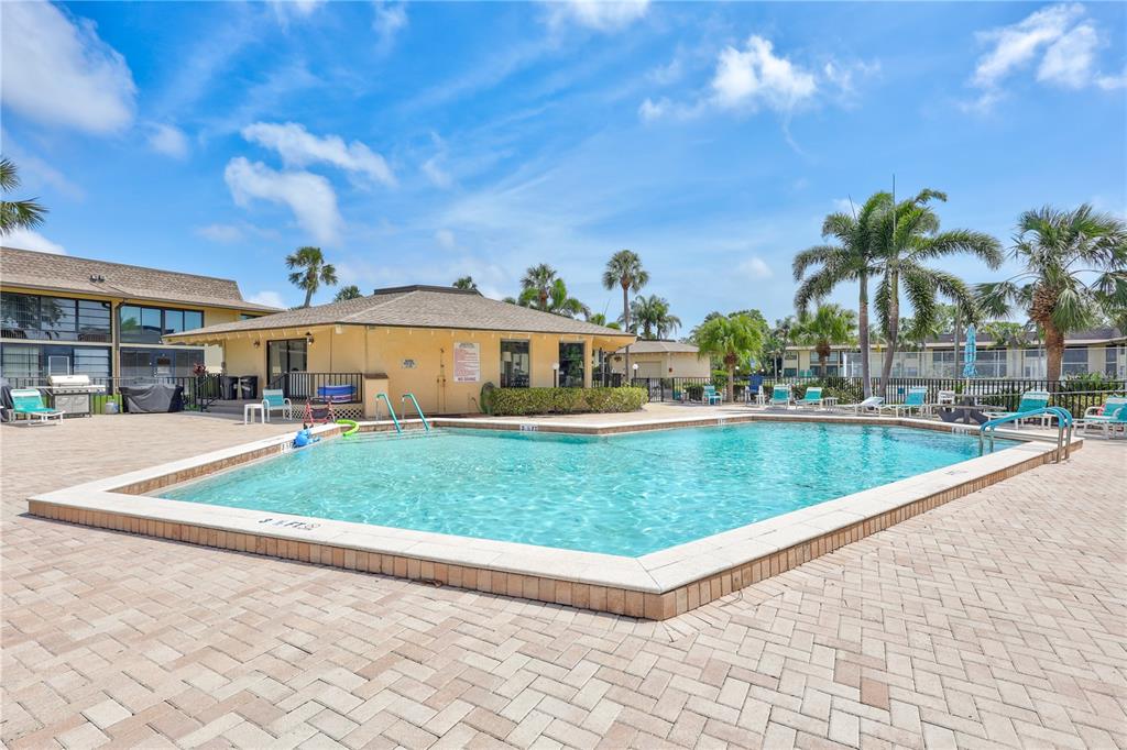 12300 Vonn Road, Unit 1102 Largo, FL 33774 - Photo 25 of 45 a view of a swimming pool with a patio