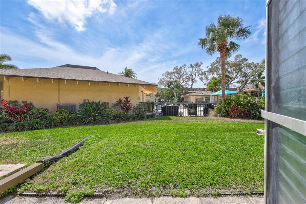 12300 Vonn Road, Unit 1102 Largo, FL 33774 - Photo 29 of 45 a view of a house with a garden