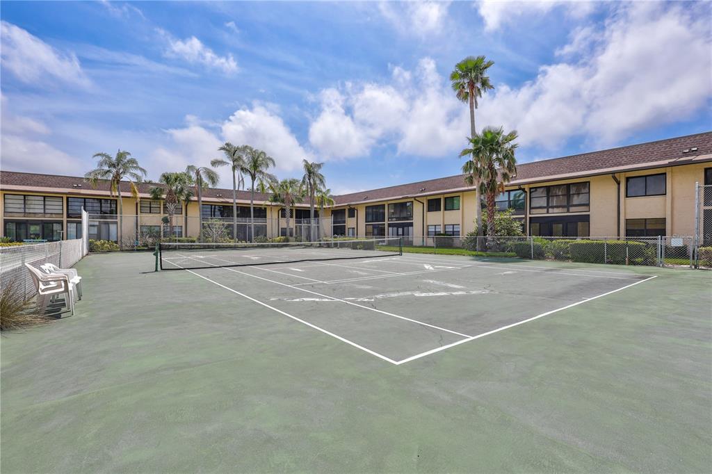 12300 Vonn Road, Unit 1102 Largo, FL 33774 - Photo 31 of 45 a view of a building with a garden