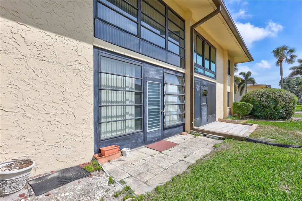12300 Vonn Road, Unit 1102 Largo, FL 33774 - Photo 36 of 45 a front view of a house with a yard