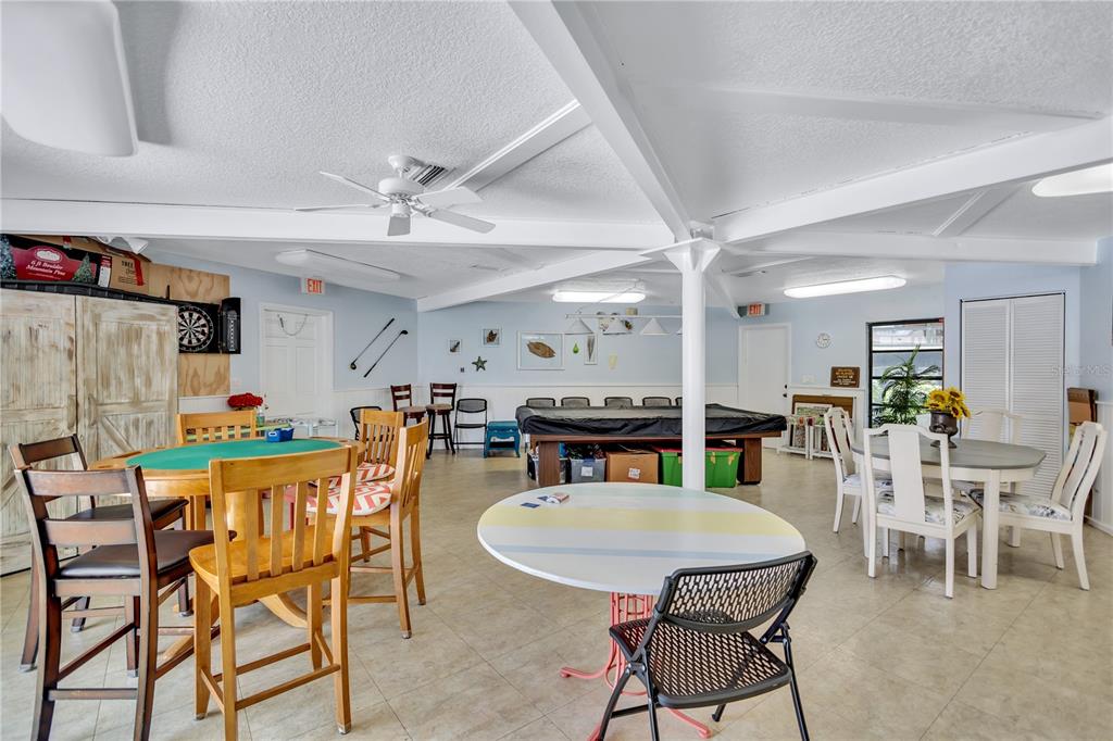 12300 Vonn Road, Unit 1102 Largo, FL 33774 - Photo 39 of 45 a view of a dining room with furniture and wooden floor