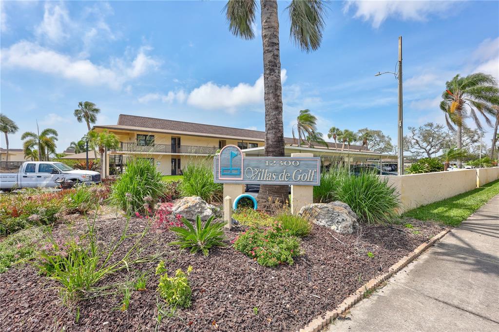 12300 Vonn Road, Unit 1102 Largo, FL 33774 - Photo 42 of 45 a front view of a house with garden