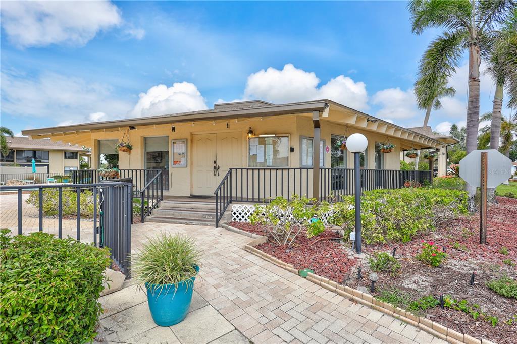 12300 Vonn Road, Unit 1102 Largo, FL 33774 - Photo 43 of 45 a front view of a house with garden