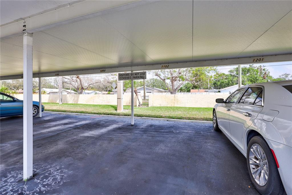 12300 Vonn Road, Unit 1102 Largo, FL 33774 - Photo 44 of 45 a view of yard with porch and furniture