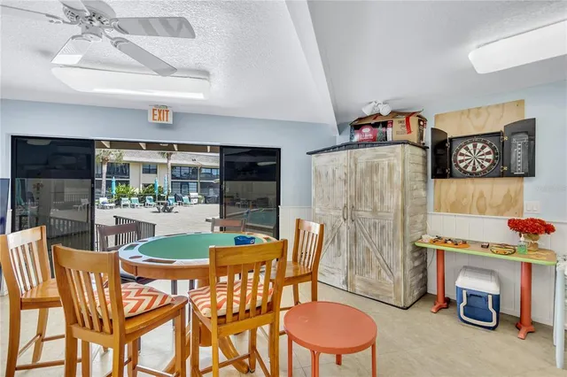 a dining room with furniture and a fireplace