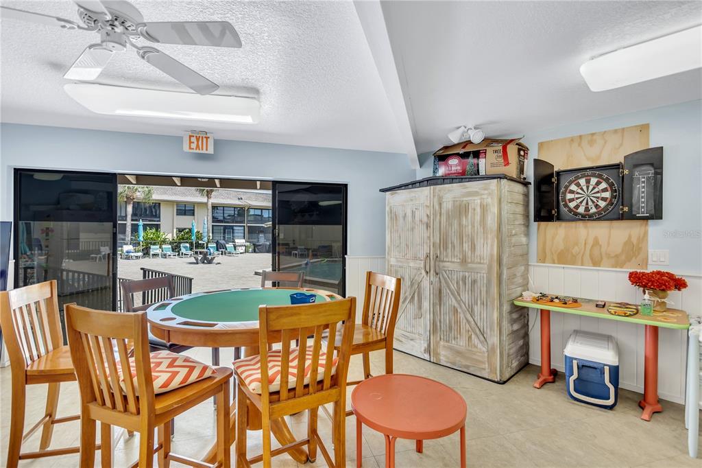 12300 Vonn Road, Unit 1102 Largo, FL 33774 - Photo 45 of 45 a dining room with furniture and a fireplace