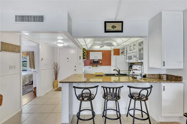 a kitchen with a table and chairs in it