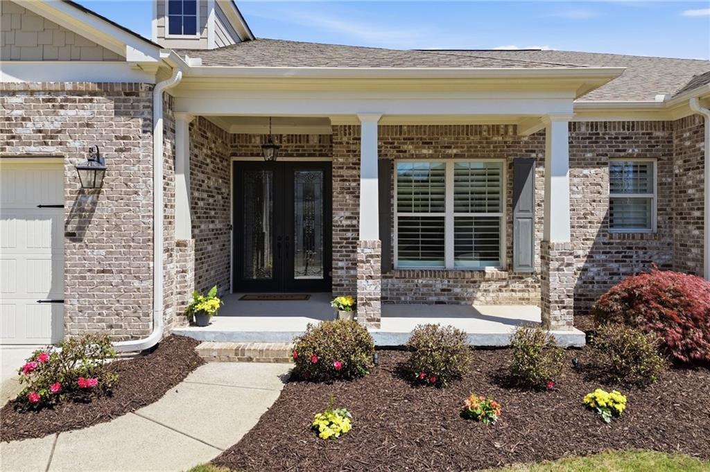 655 Hemlock Trail Canton, GA 30114 - Photo 2 of 58 a front view of a house with outdoor seating