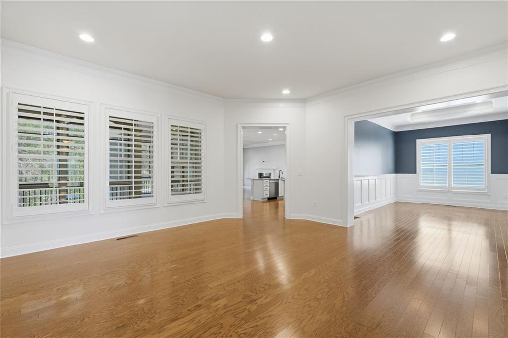 655 Hemlock Trail Canton, GA 30114 - Photo 22 of 58 a view of an empty room with wooden floor and a window
