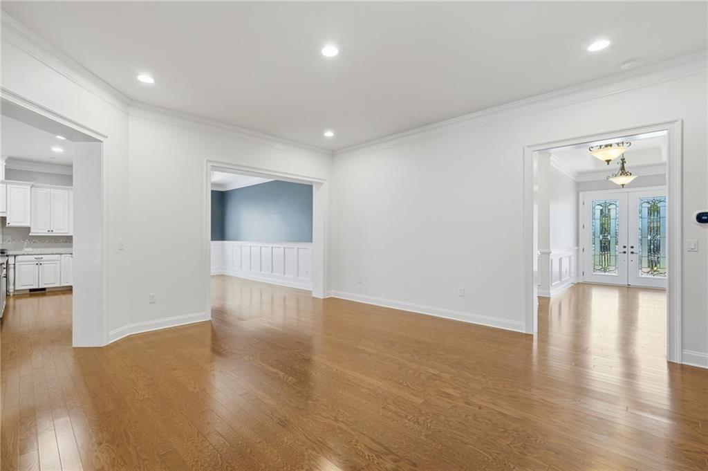 655 Hemlock Trail Canton, GA 30114 - Photo 23 of 58 a view of an empty room with wooden floor and a bathroom