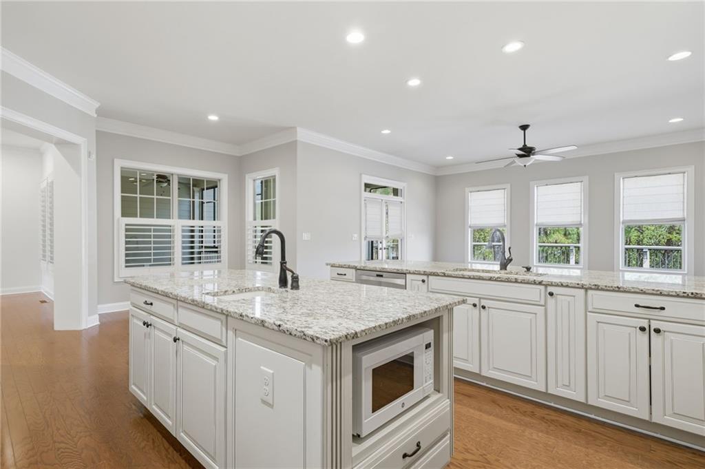 655 Hemlock Trail Canton, GA 30114 - Photo 30 of 58 a kitchen that has a sink and a stove in it
