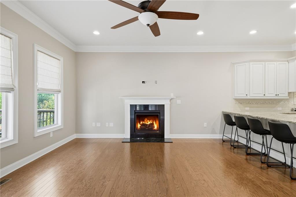655 Hemlock Trail Canton, GA 30114 - Photo 33 of 58 a view of an empty room with window and wooden floor