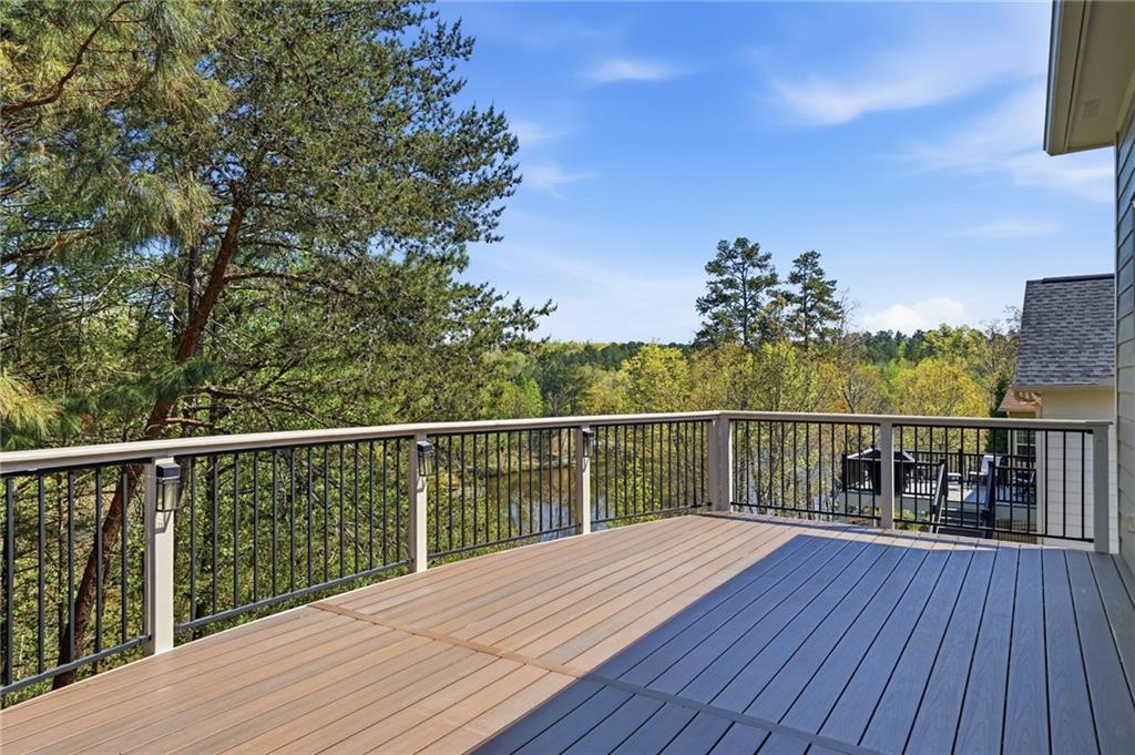 655 Hemlock Trail Canton, GA 30114 - Photo 46 of 58 a view of balcony with wooden floor and fence