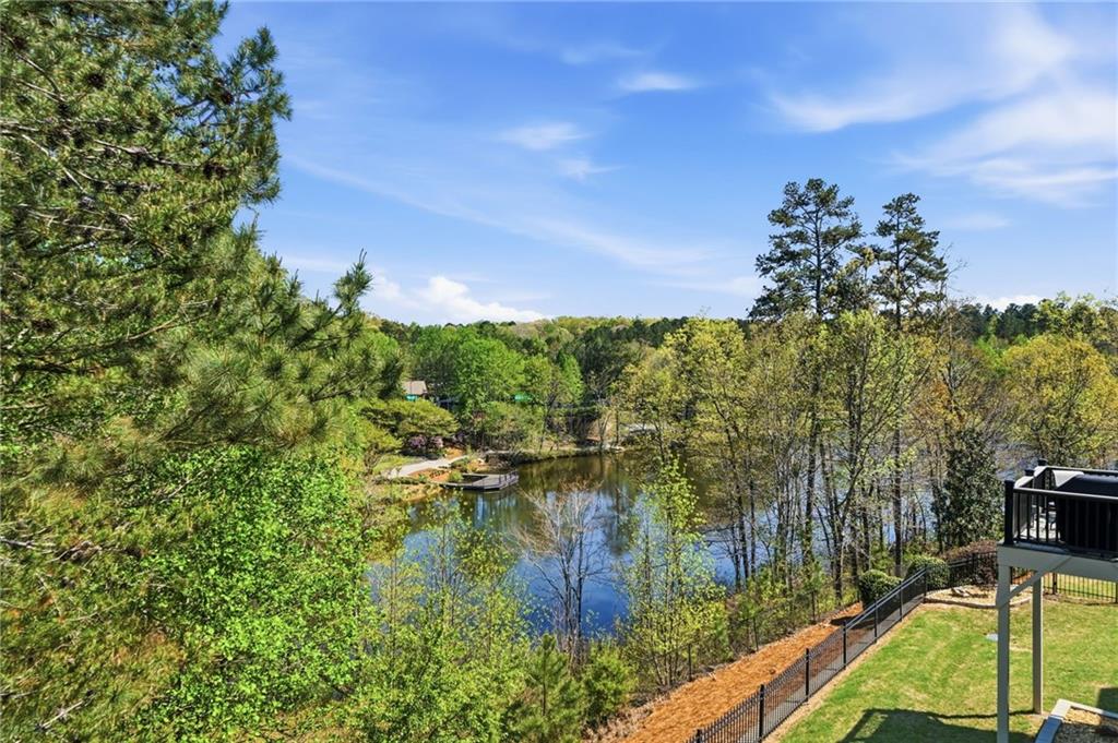 655 Hemlock Trail Canton, GA 30114 - Photo 47 of 58 a view of a lake with houses