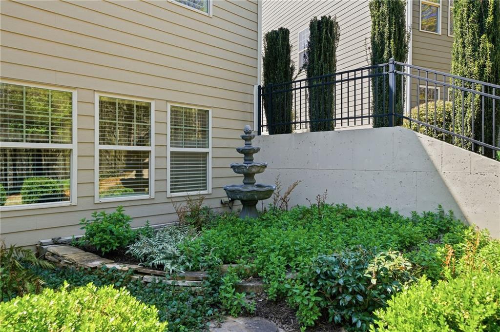 655 Hemlock Trail Canton, GA 30114 - Photo 52 of 58 a view of a house with a small yard and wooden floor and fence