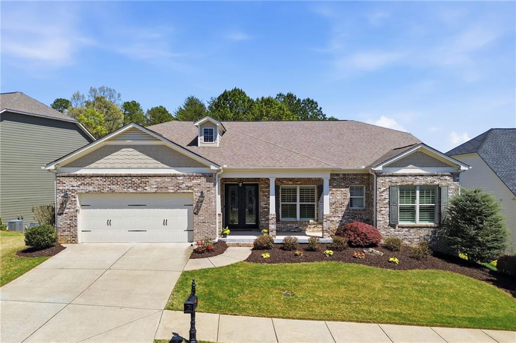 655 Hemlock Trail Canton, GA 30114 - Photo 9 of 58 a view of a house with a garden and yard