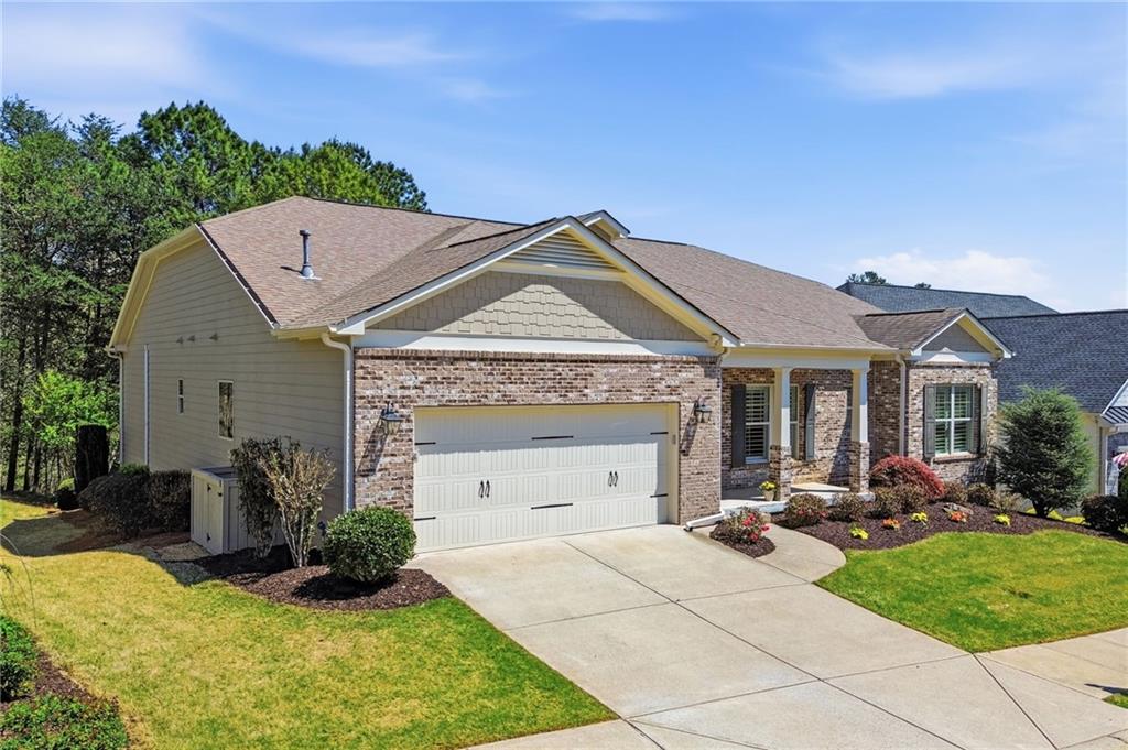655 Hemlock Trail Canton, GA 30114 - Photo 10 of 58 a view of house with yard outdoor seating and entertaining space