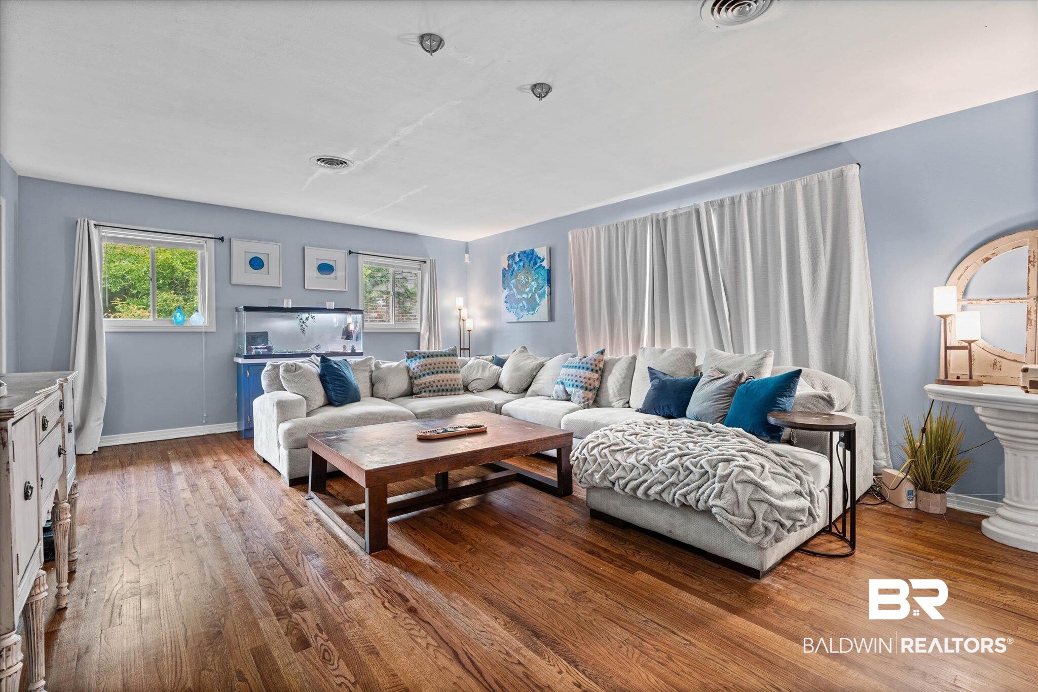 4213 Shan Drive East Mobile, AL 36693 - Photo 3 of 35 Spacious room featuring wood-finish flooring, light blue wall paint, multiple windows, and recessed lighting