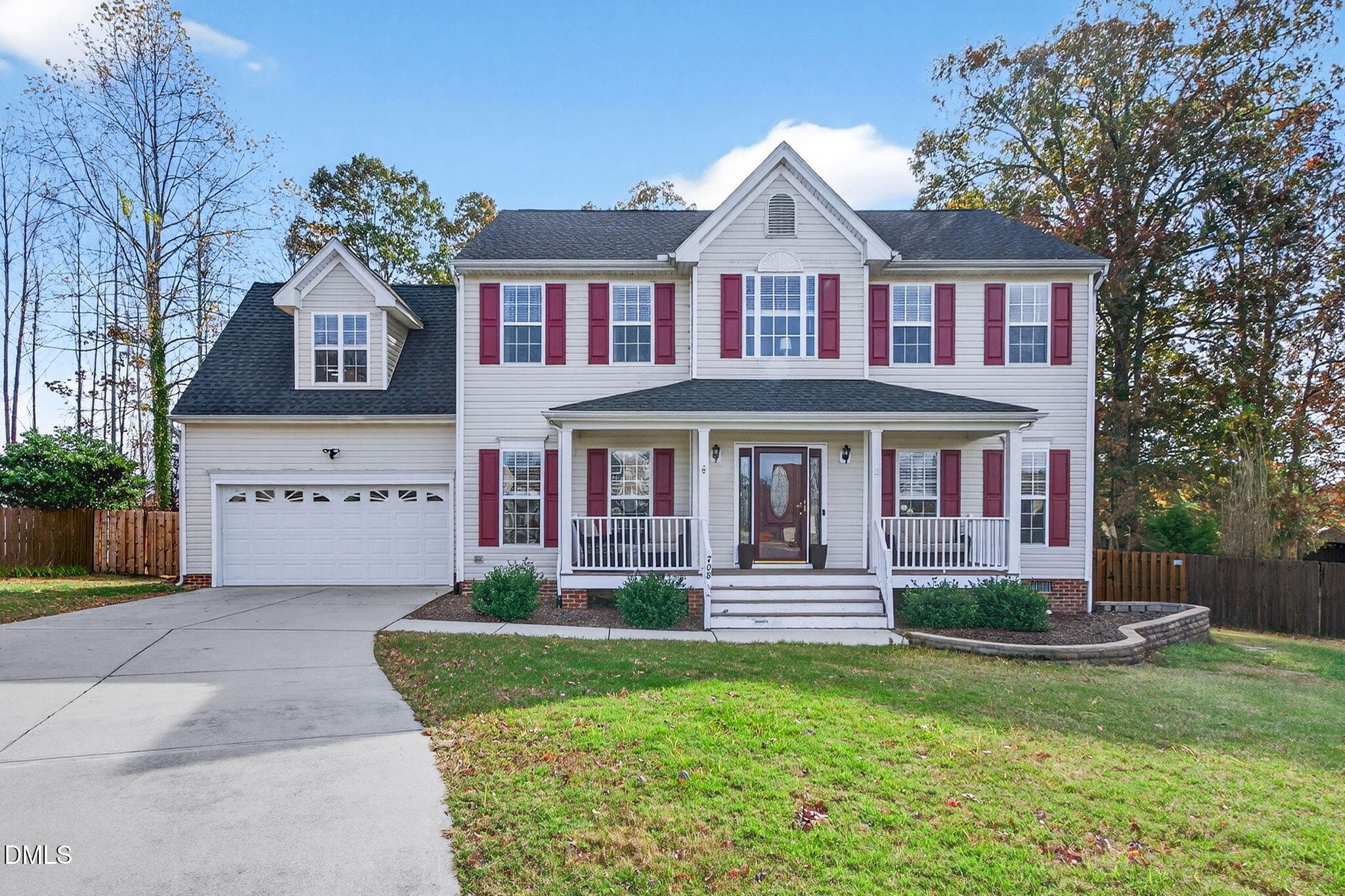 708 Quiet Walk Circle Rolesville, NC 27571 - Photo 1 of 56 a front view of a house with a yard table and chairs
