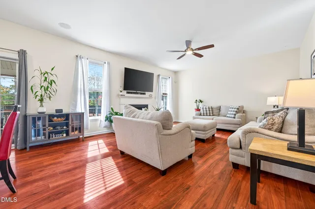 a view of a livingroom with furniture and a flat screen tv