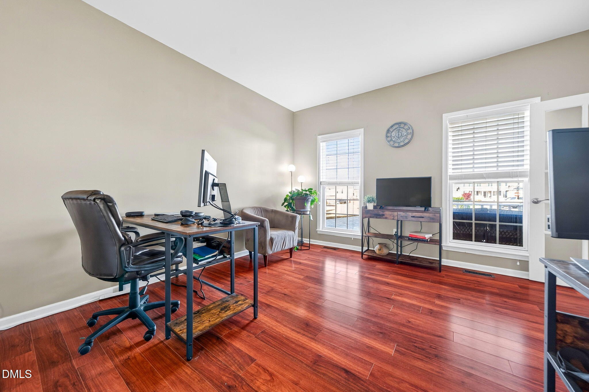 708 Quiet Walk Circle Rolesville, NC 27571 - Photo 20 of 56 a view of a livingroom with furniture and a flat screen tv