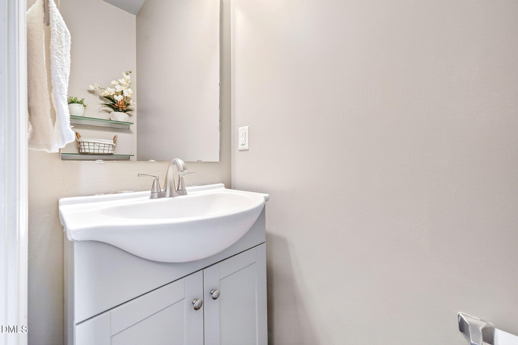 708 Quiet Walk Circle Rolesville, NC 27571 - Photo 21 of 56 a bathroom with a sink and a mirror