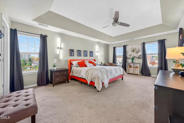 a bedroom with a bed and lamp