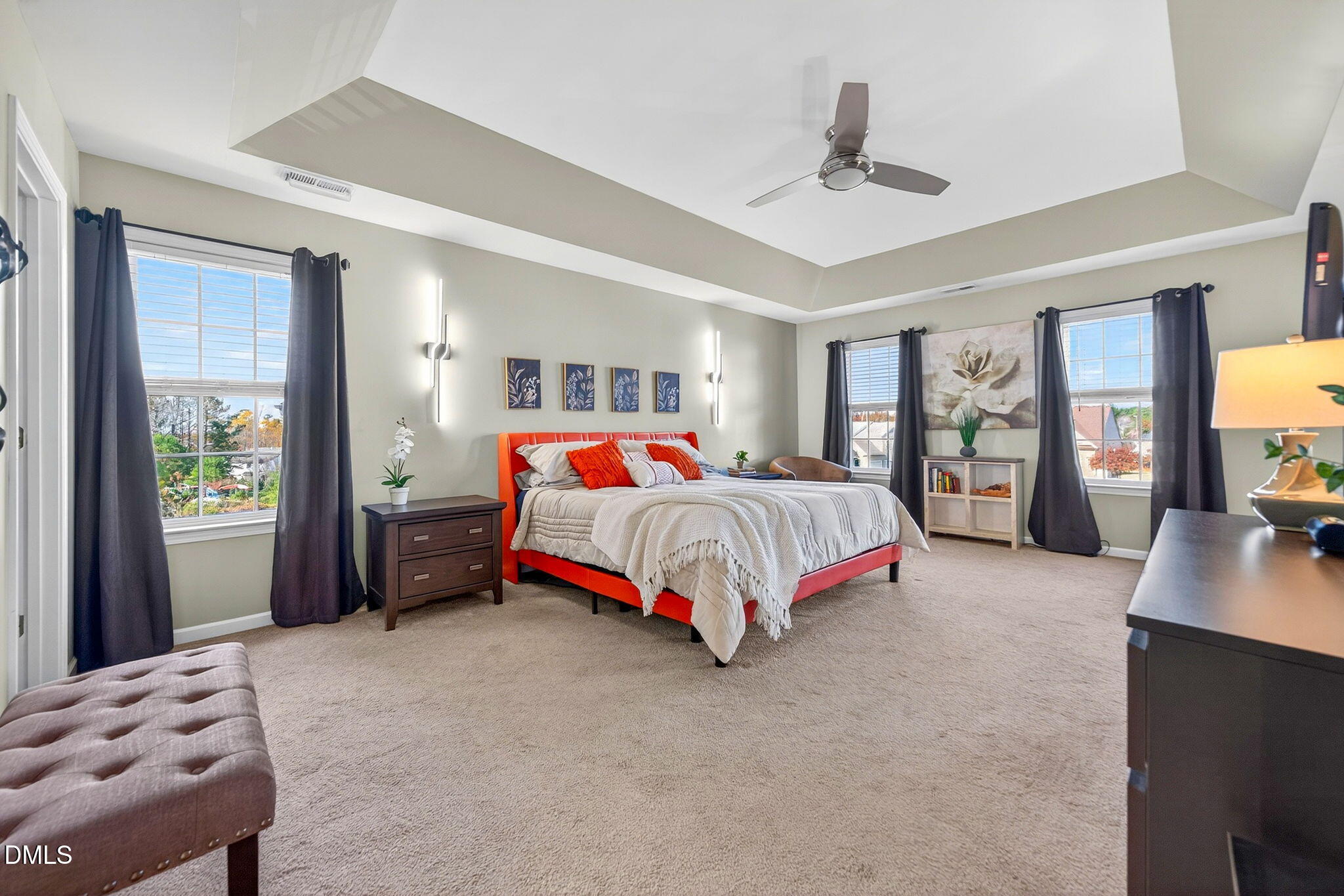 708 Quiet Walk Circle Rolesville, NC 27571 - Photo 22 of 56 a bedroom with a bed and a dresser next to a window