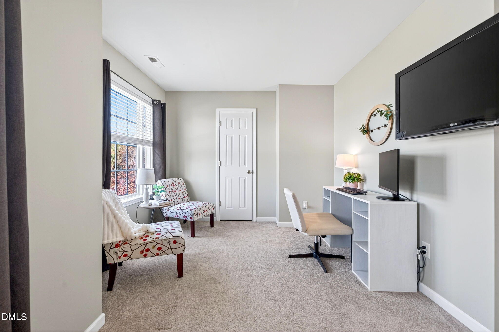 708 Quiet Walk Circle Rolesville, NC 27571 - Photo 24 of 56 a living room with furniture and a flat screen tv