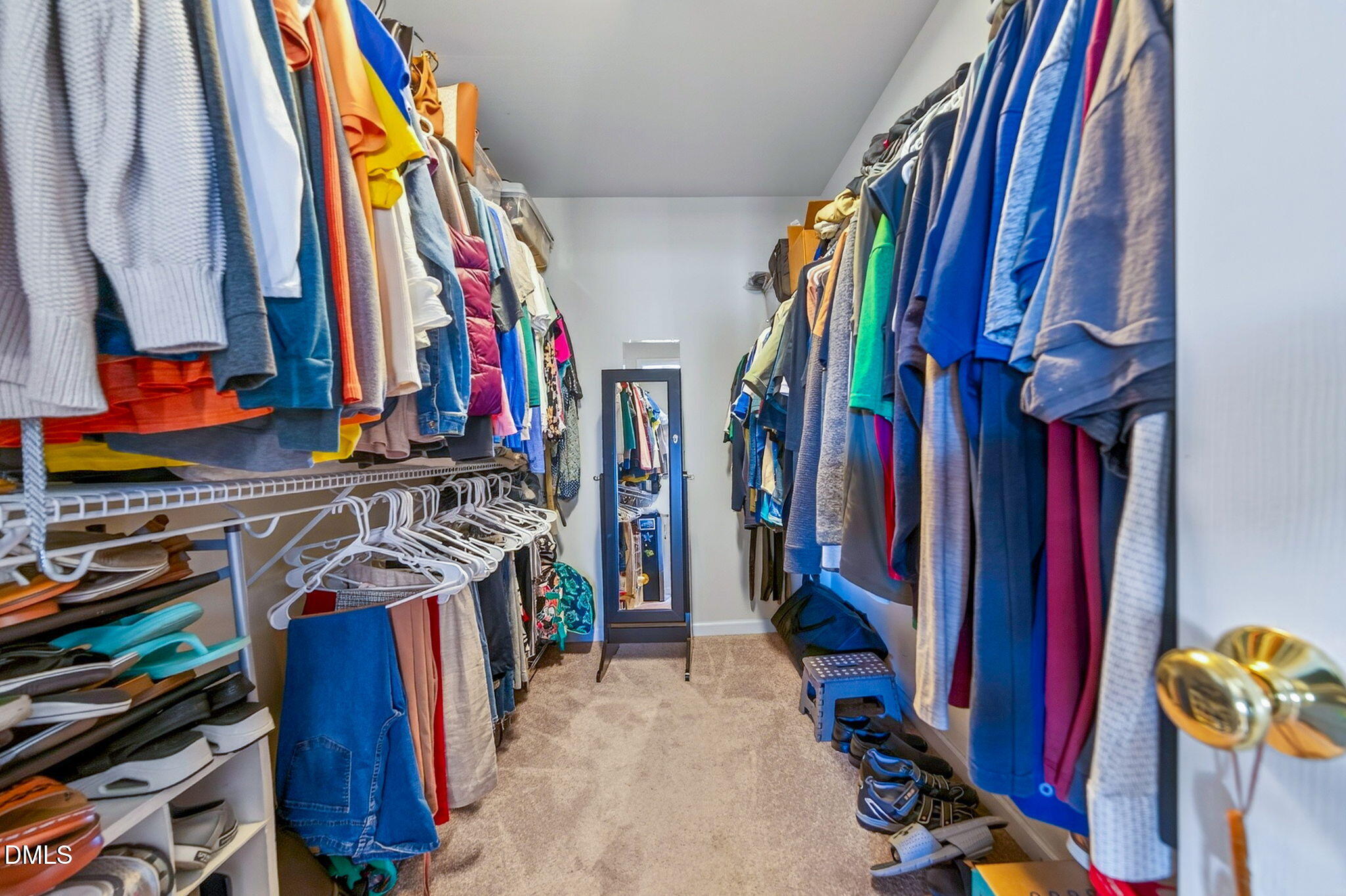708 Quiet Walk Circle Rolesville, NC 27571 - Photo 26 of 56 a view of walk in closet with clothes