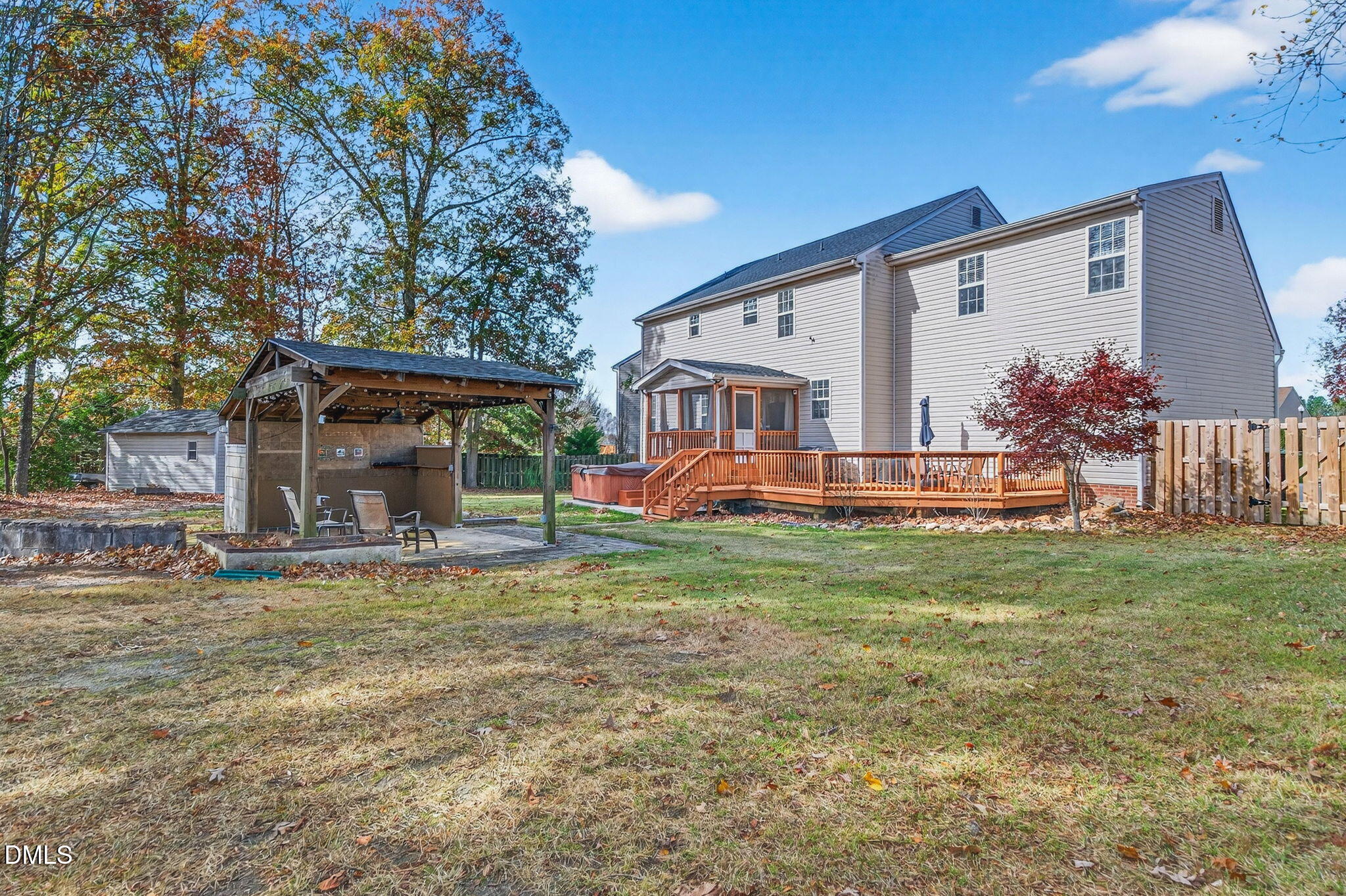 708 Quiet Walk Circle Rolesville, NC 27571 - Photo 50 of 56 a view of a house with backyard and a tree