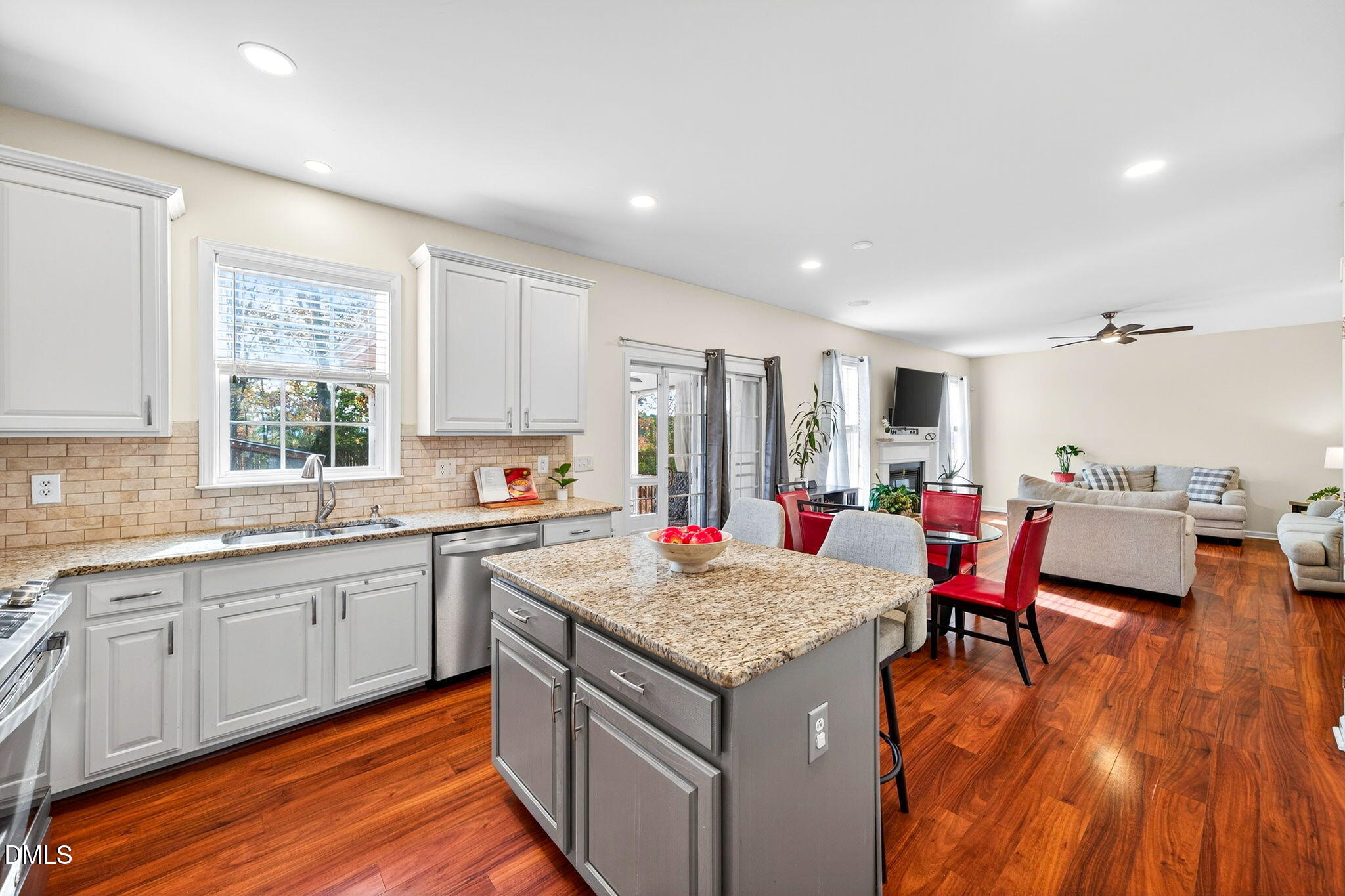 708 Quiet Walk Circle Rolesville, NC 27571 - Photo 10 of 56 a open kitchen with granite countertop a sink and chairs