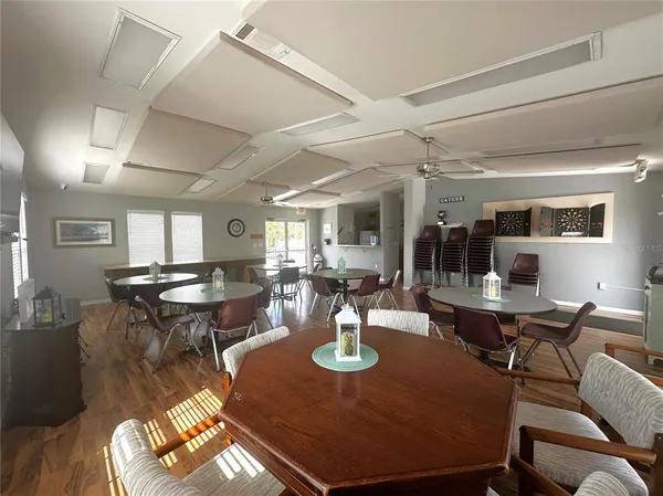 a living room with lots of furniture and a large window