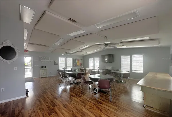 a view of a workspace with bookshelf