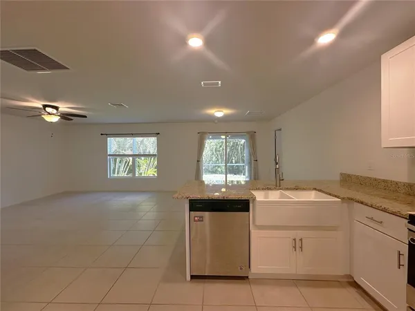a kitchen with a sink and cabinets