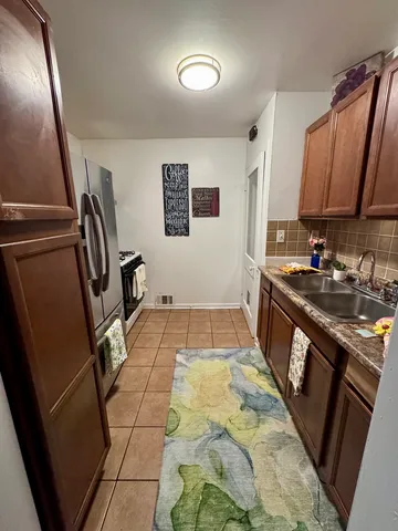 a bathroom with a sink a mirror and a toilet