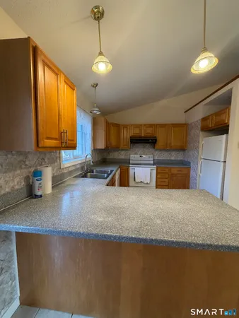 a view of a room with wooden floor and staircase