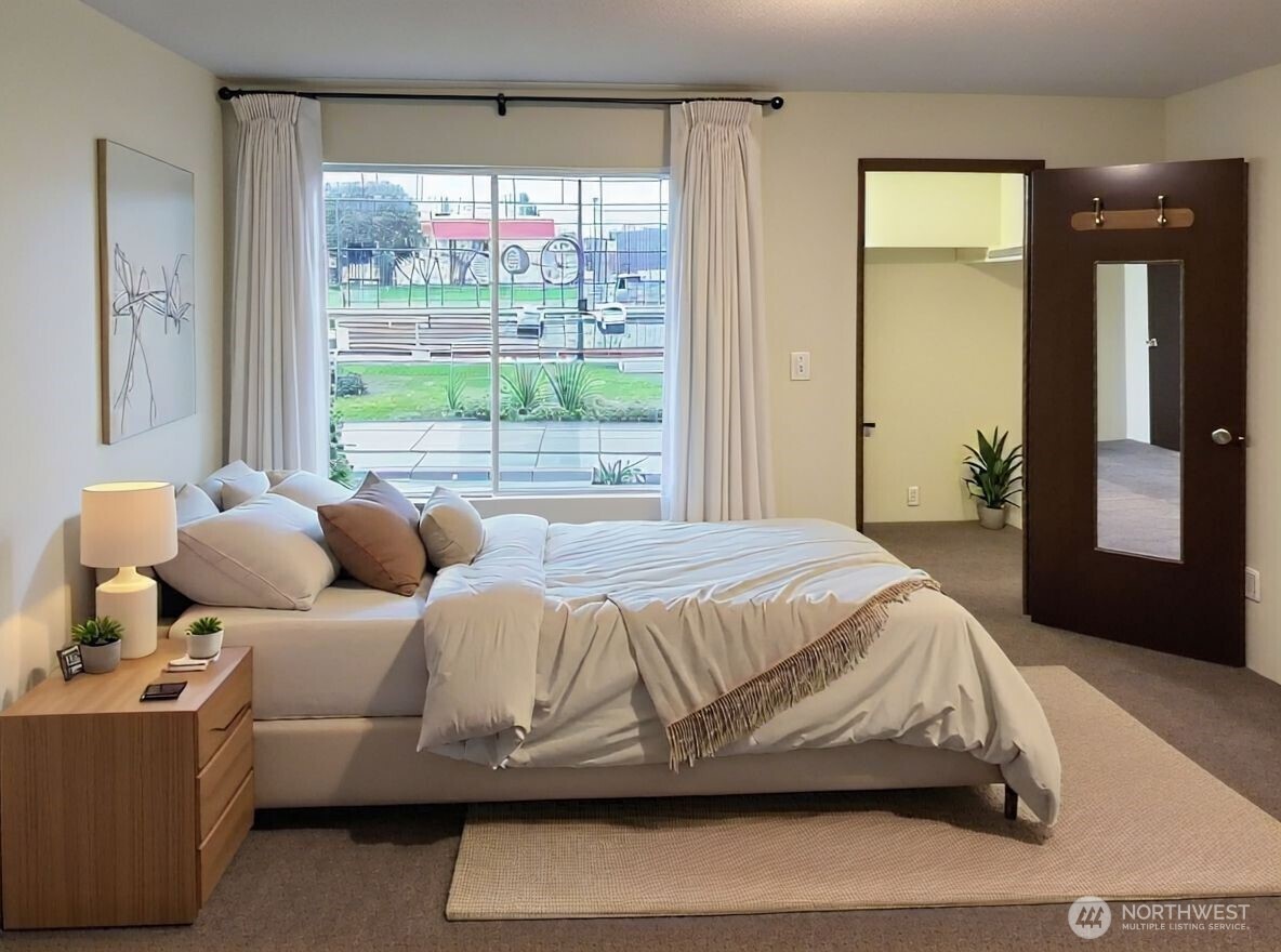 8854 Interlake Avenue North Seattle, WA 98103 - Photo 11 of 23 a bedroom with bed and window