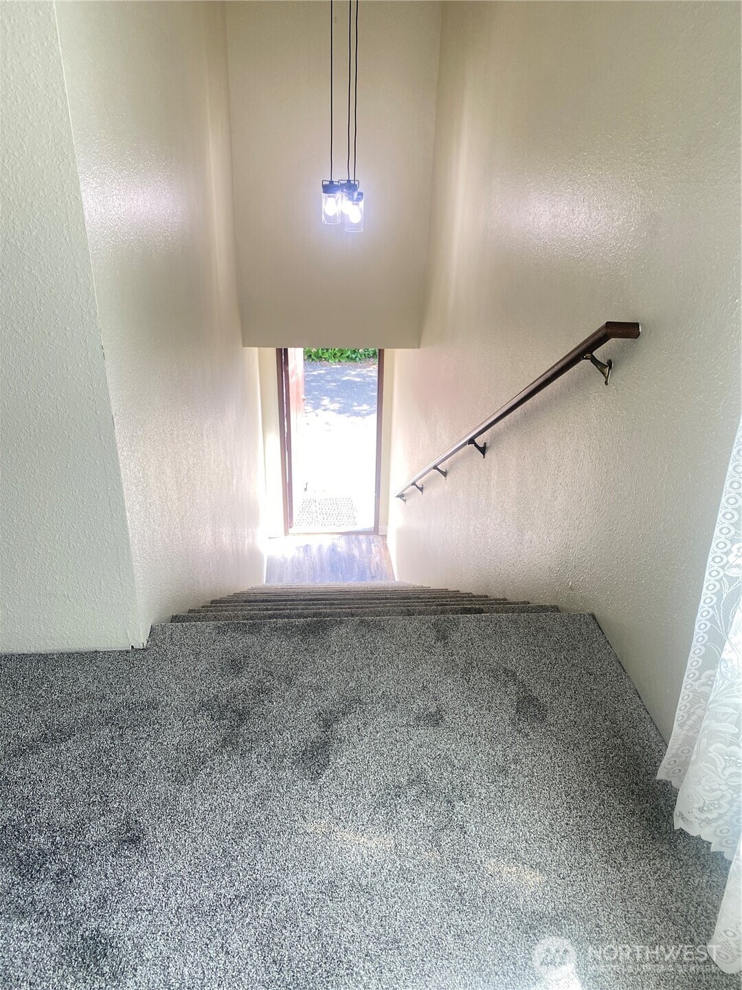 8854 Interlake Avenue North Seattle, WA 98103 - Photo 19 of 23 an empty room with windows and fan